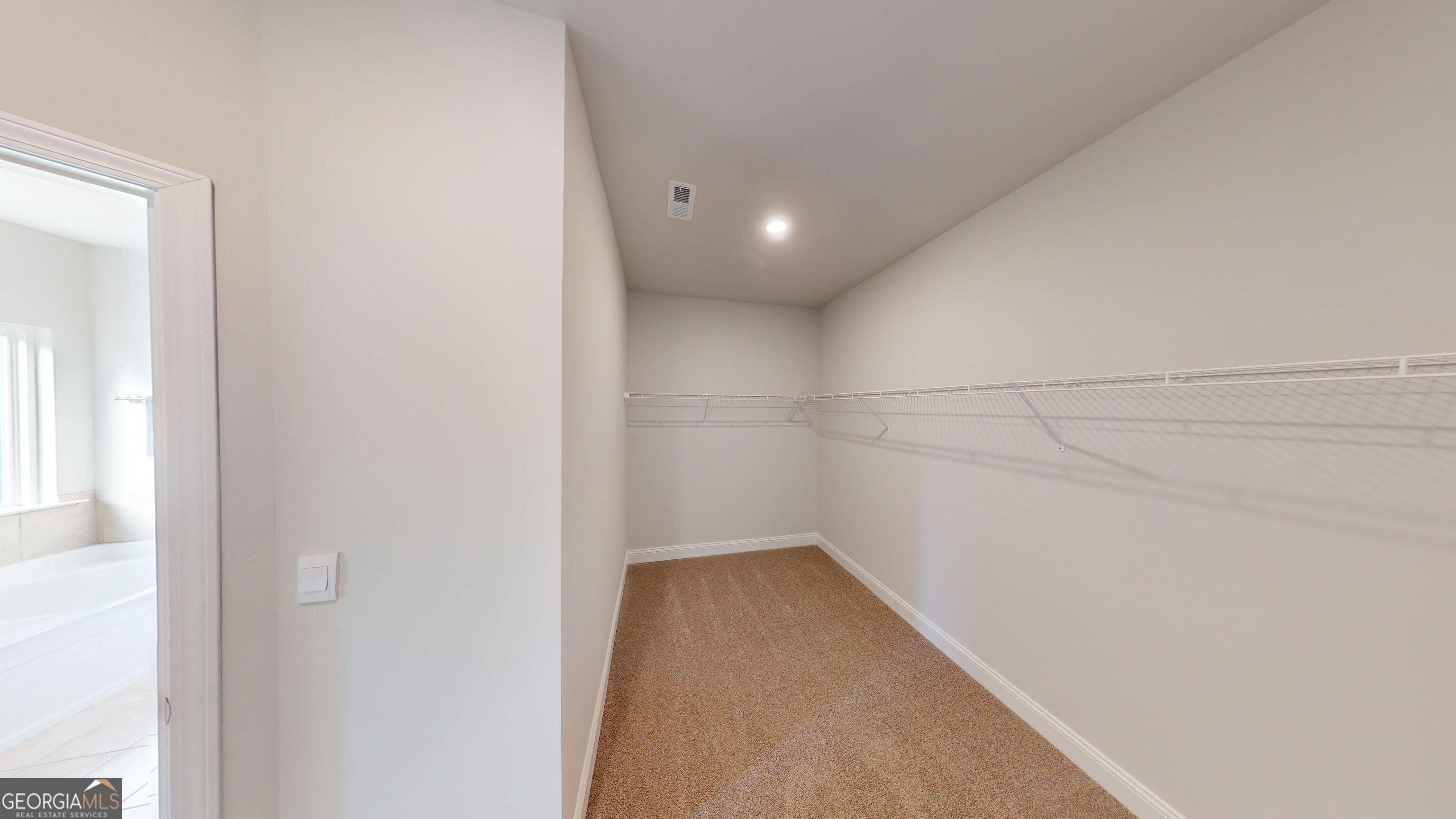 337 Stockton Circle Macon, GA 31216 - Photo 21 of 40 a view of a room with racks on the wall