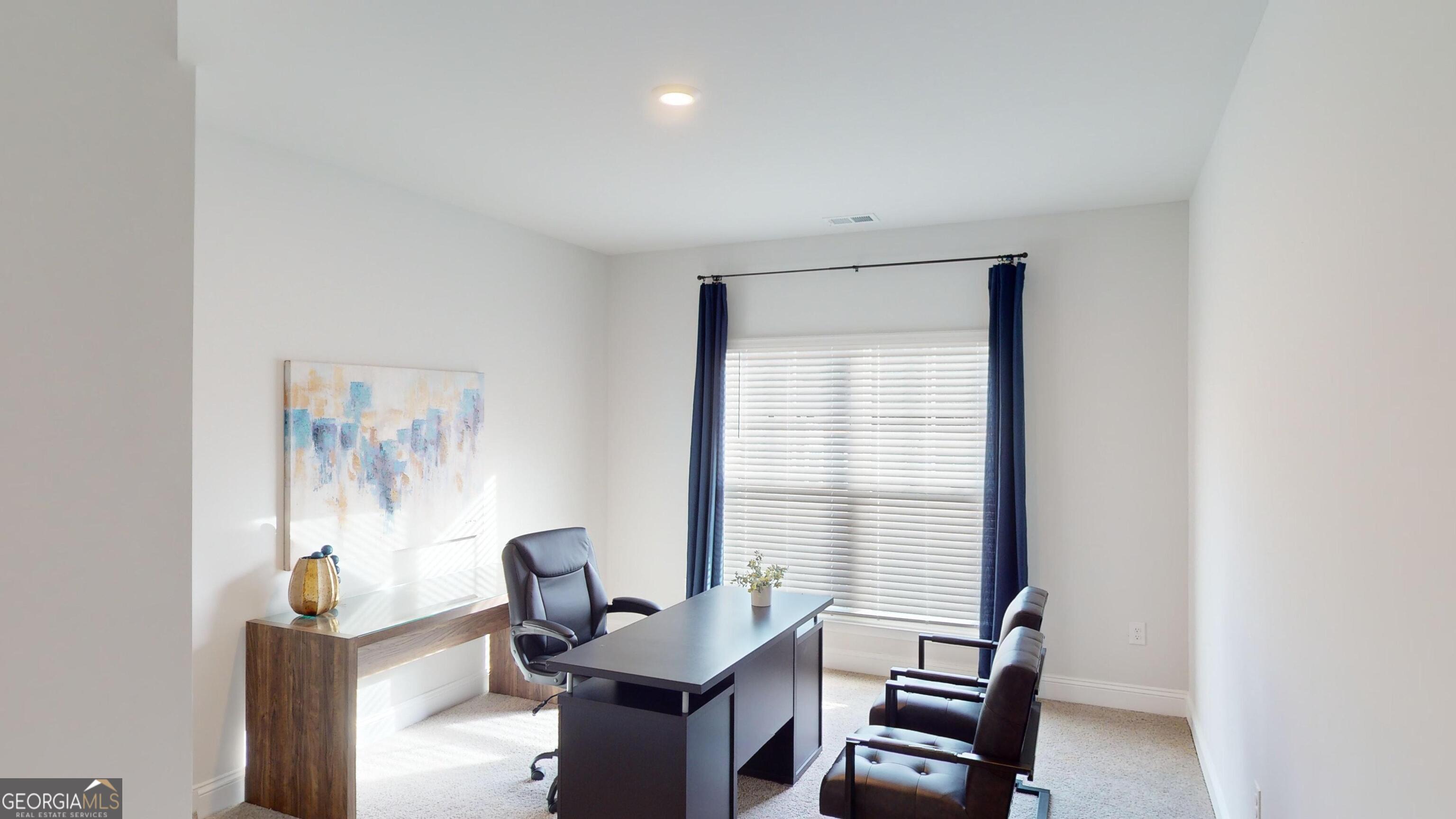 337 Stockton Circle Macon, GA 31216 - Photo 24 of 40 a view of a workspace with furniture and a window