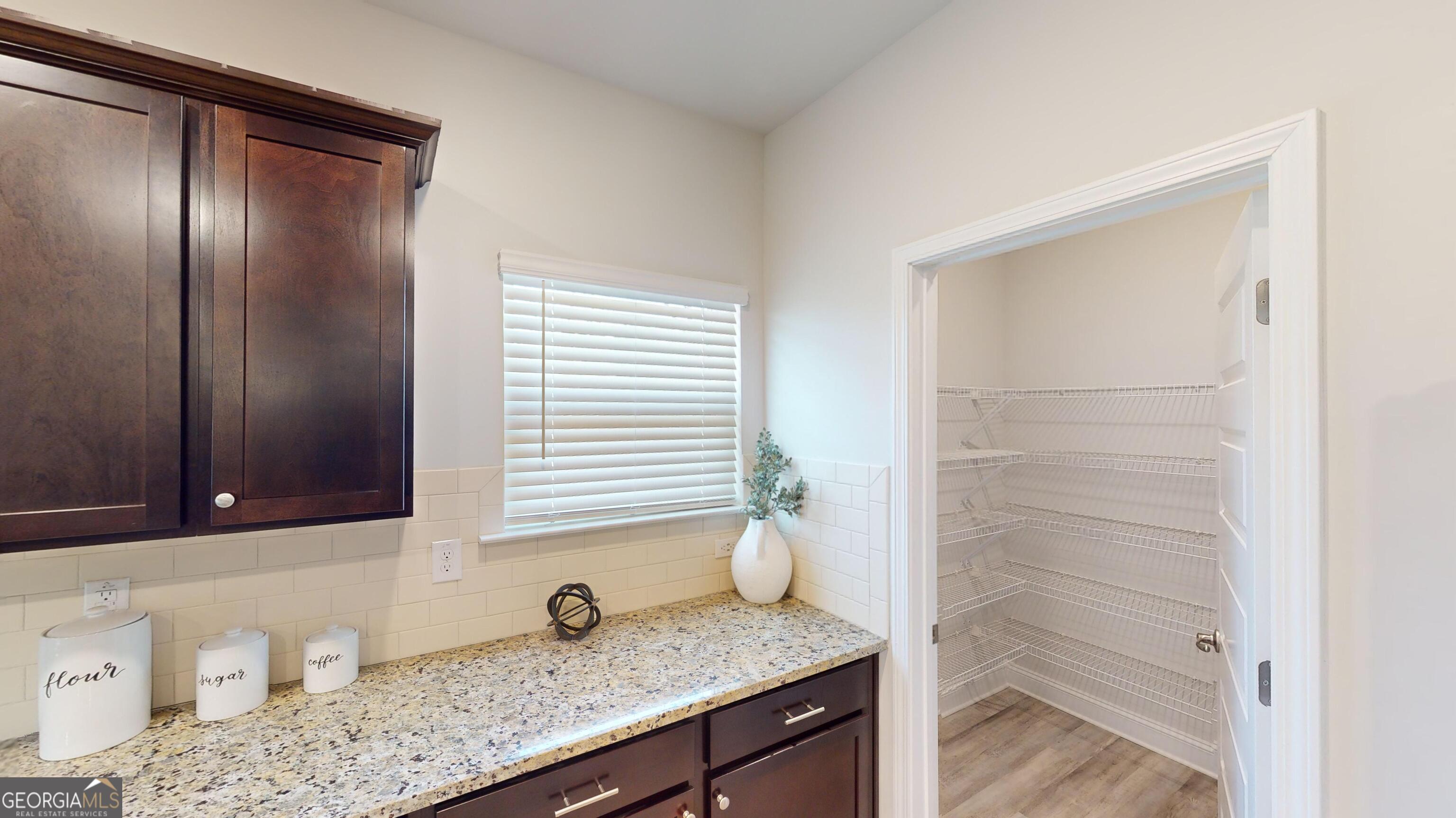 337 Stockton Circle Macon, GA 31216 - Photo 37 of 40 a bathroom with a granite countertop sink and a mirror