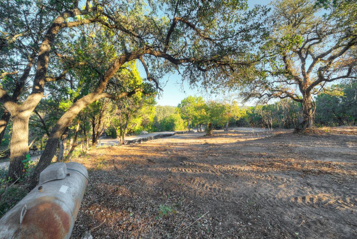 18303 West Rim Drive Jonestown, TX 78645 - Photo 21 of 36 Propane tank is close to where the structure was on the property.