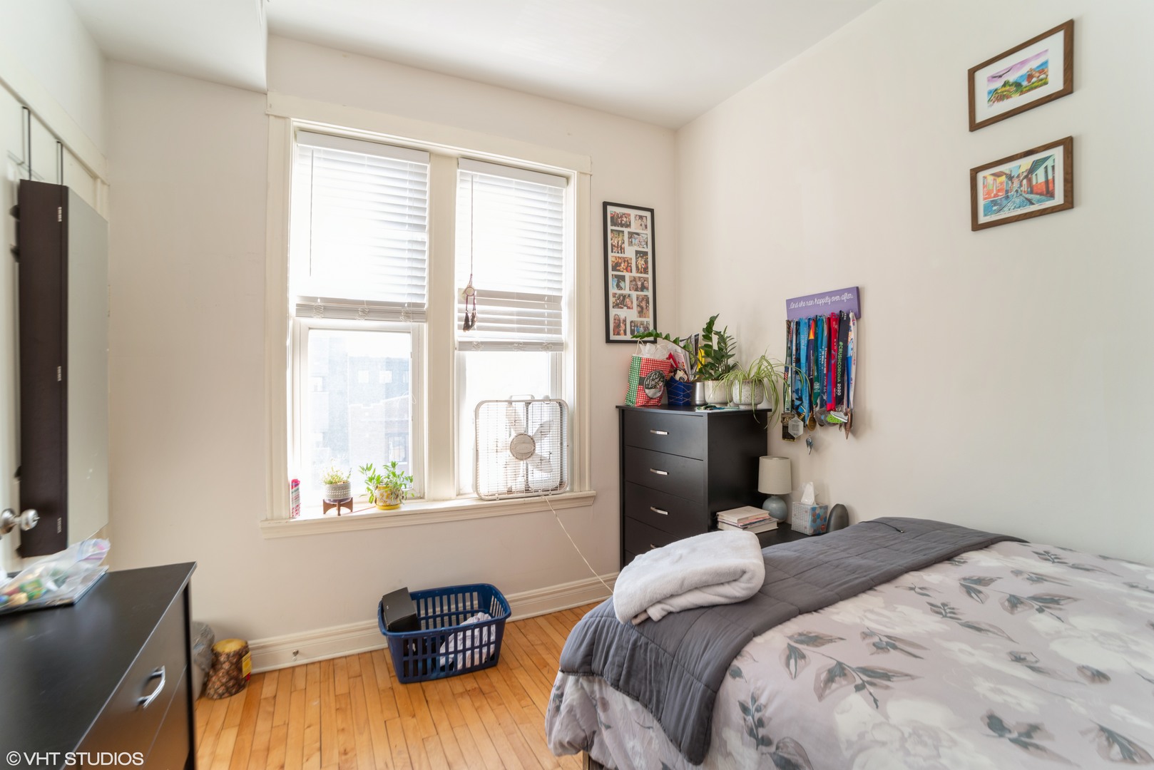 Undisclosed Address Chicago, IL 60647 - Photo 4 of 9 a bedroom with a bed and a window