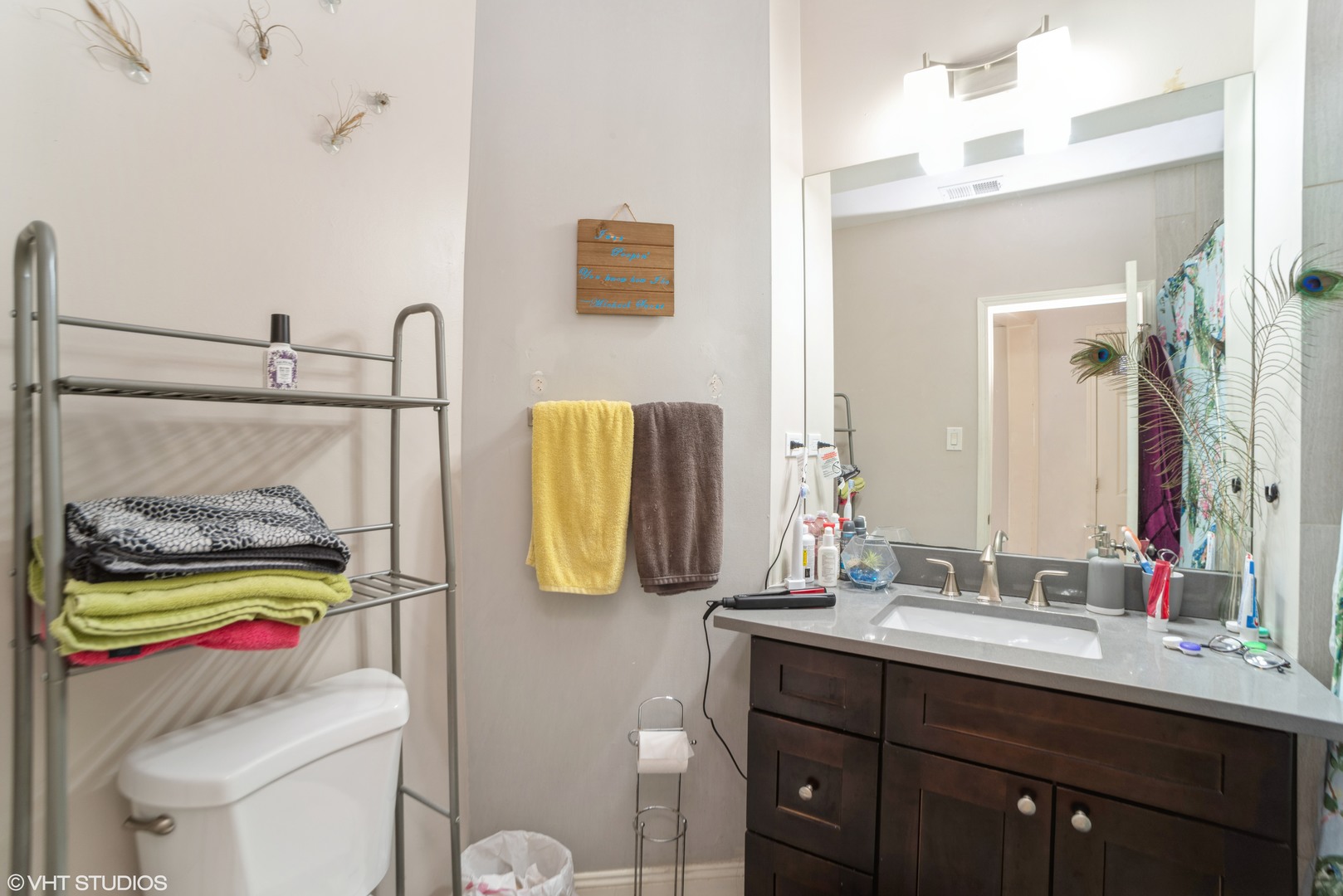 Undisclosed Address Chicago, IL 60647 - Photo 9 of 9 a bathroom with a sink vanity mirror and toilet