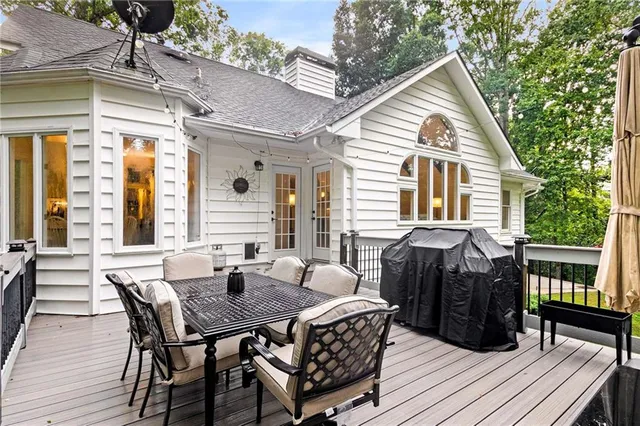 a view of a house with patio and wooden floor