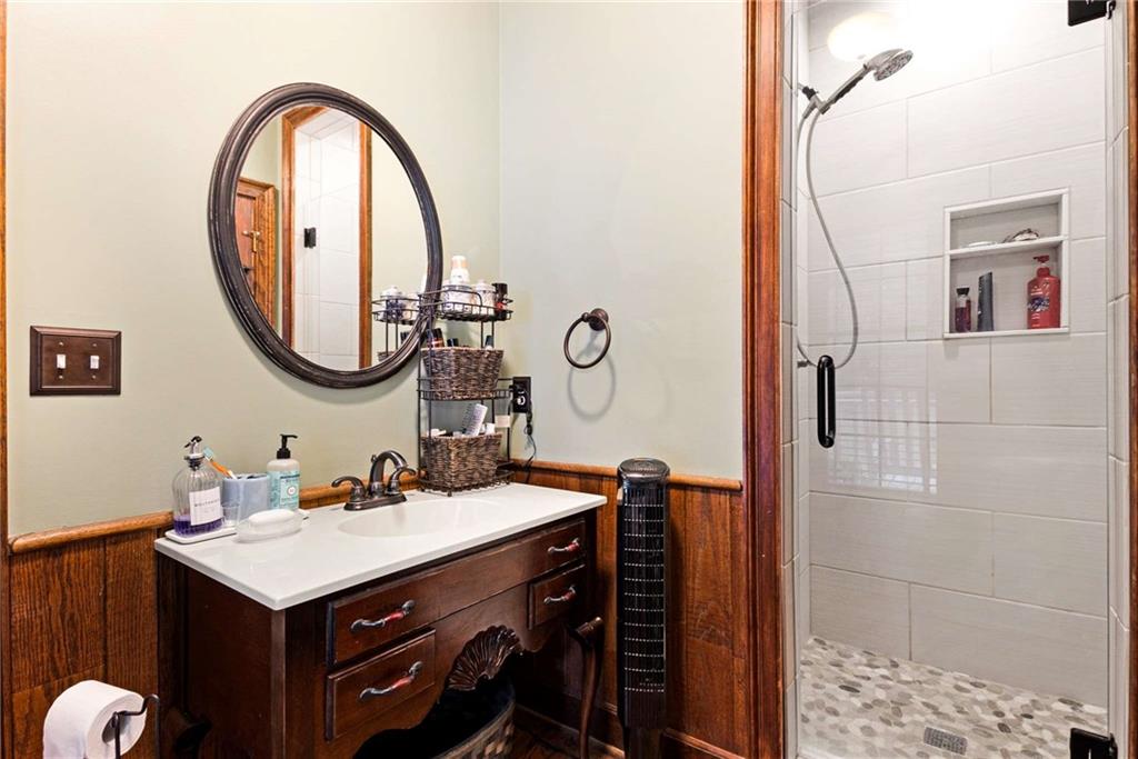 3728 Beaver Creek Road Gainesville, GA 30506 - Photo 15 of 28 a bathroom with a sink vanity and a mirror