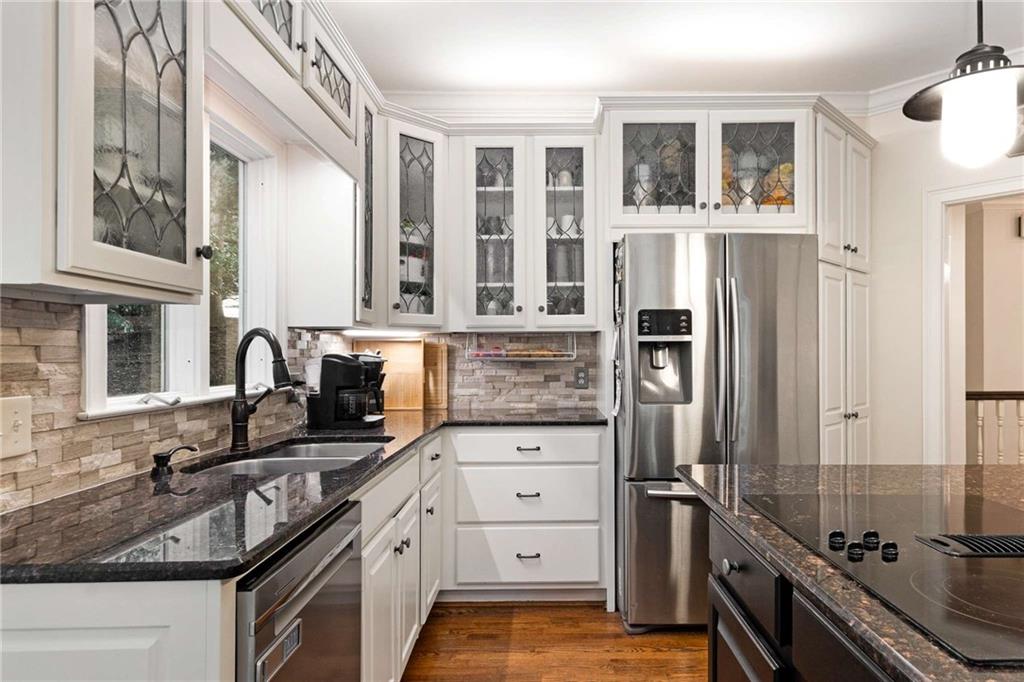 3728 Beaver Creek Road Gainesville, GA 30506 - Photo 4 of 28 a kitchen with granite countertop a refrigerator stove and sink