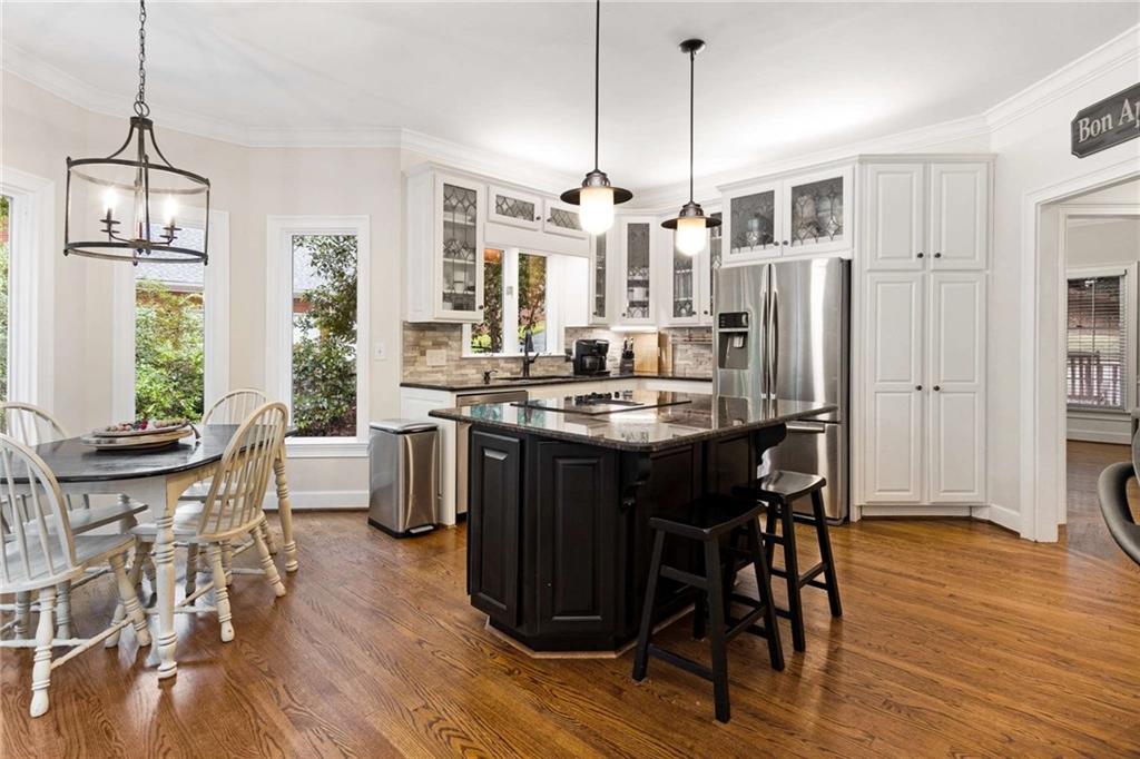 3728 Beaver Creek Road Gainesville, GA 30506 - Photo 5 of 28 a kitchen with stainless steel appliances a dining table chairs and granite counter tops