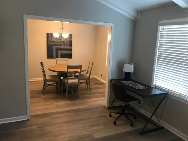 a workspace with furniture and a window