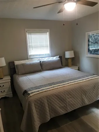 a bedroom with a bed and window
