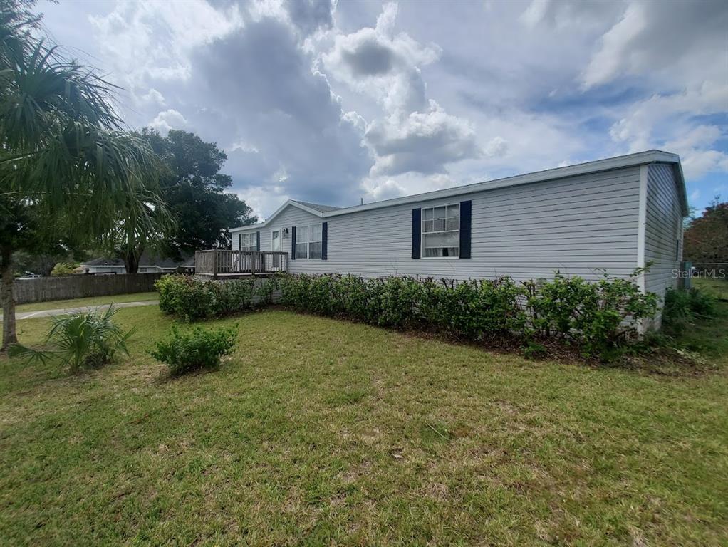 a backyard of a house with lots of green space