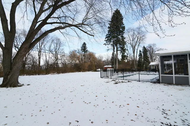 a view of house with snow on the background