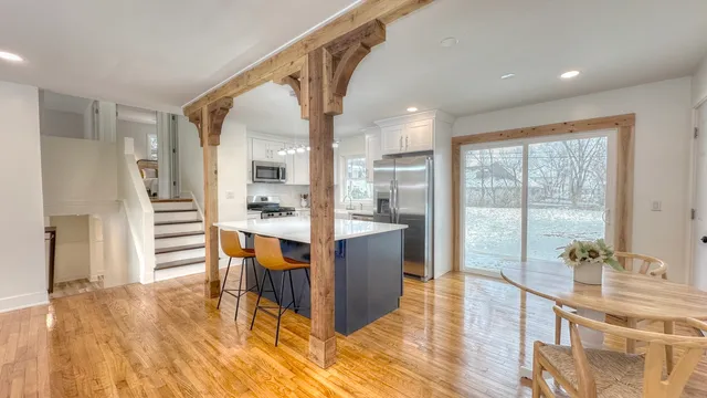 a dining room with furniture and wooden floor