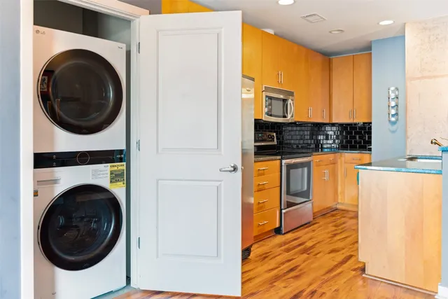 a view of a kitchen with washer and dryer