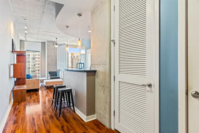 a dining room with furniture and wooden floor