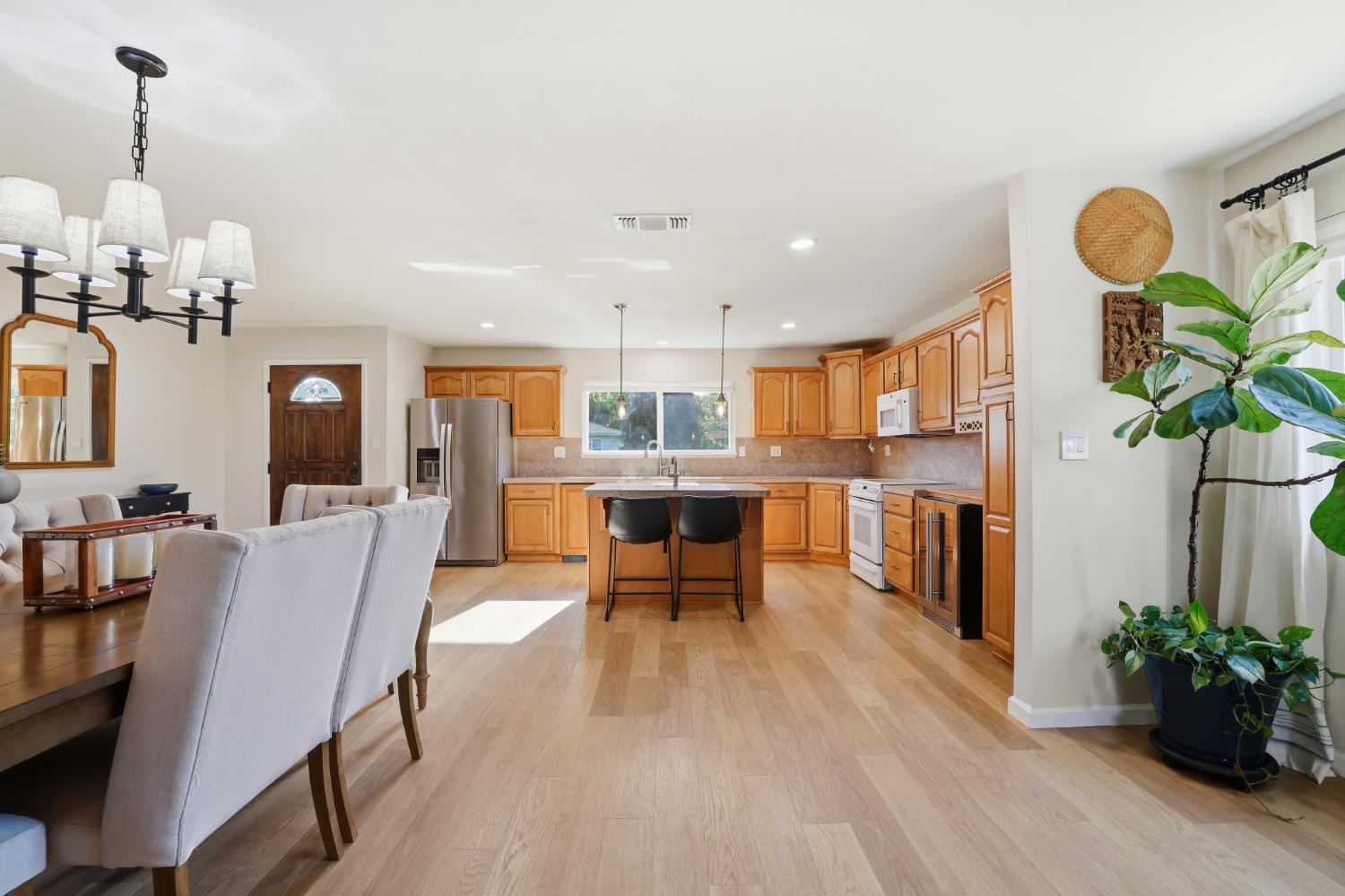 5295 Baumgart Way Carmichael, CA 95608 - Photo 11 of 46 a dining room with furniture and wooden floor