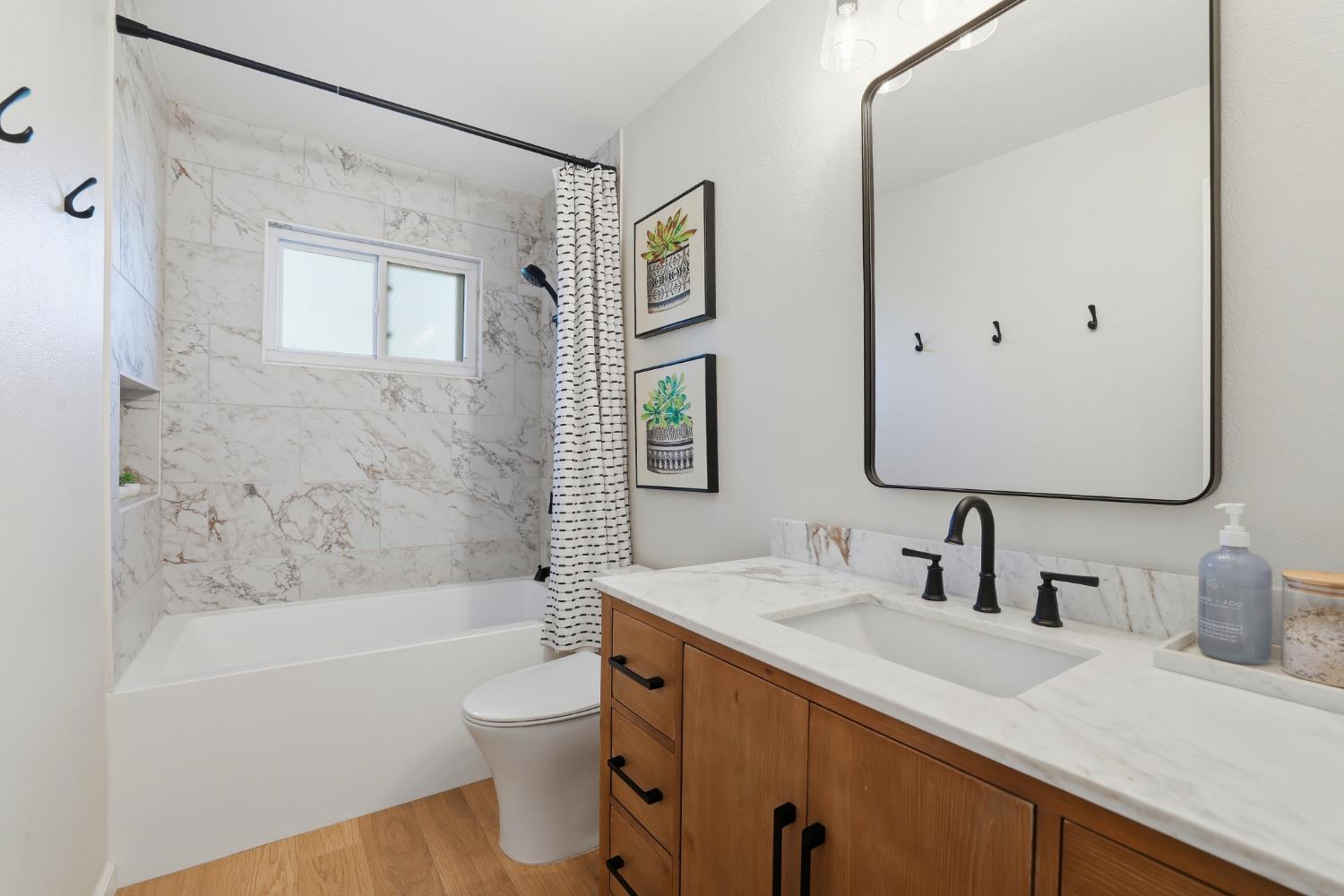 5295 Baumgart Way Carmichael, CA 95608 - Photo 20 of 46 a bathroom with a granite countertop sink toilet tub and shower