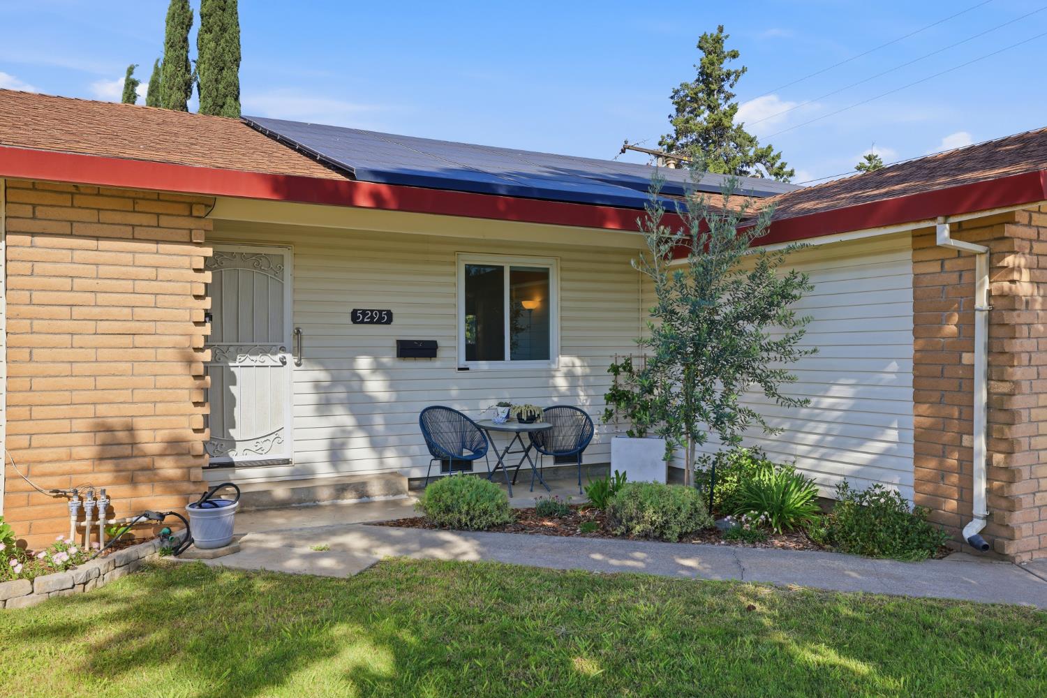 5295 Baumgart Way Carmichael, CA 95608 - Photo 2 of 46 a front view of a house with garden
