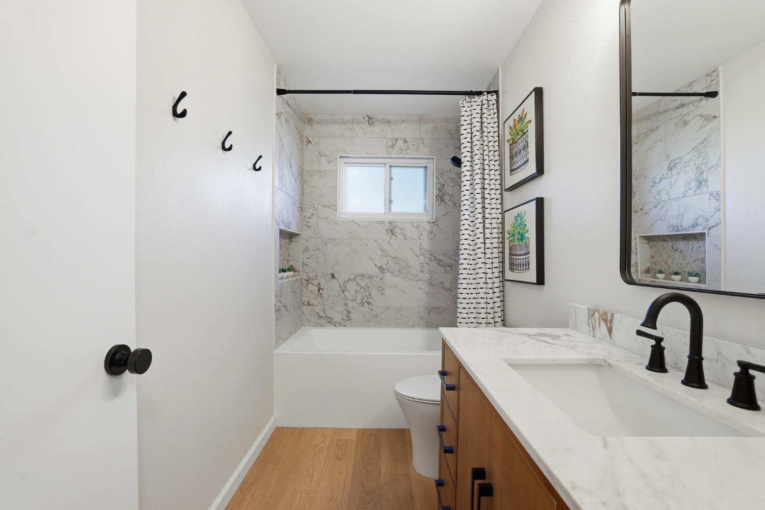 5295 Baumgart Way Carmichael, CA 95608 - Photo 21 of 46 a bathroom with a sink and a bathtub