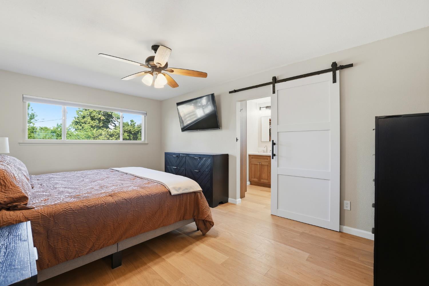 5295 Baumgart Way Carmichael, CA 95608 - Photo 22 of 46 a bedroom with a bed and a refrigerator