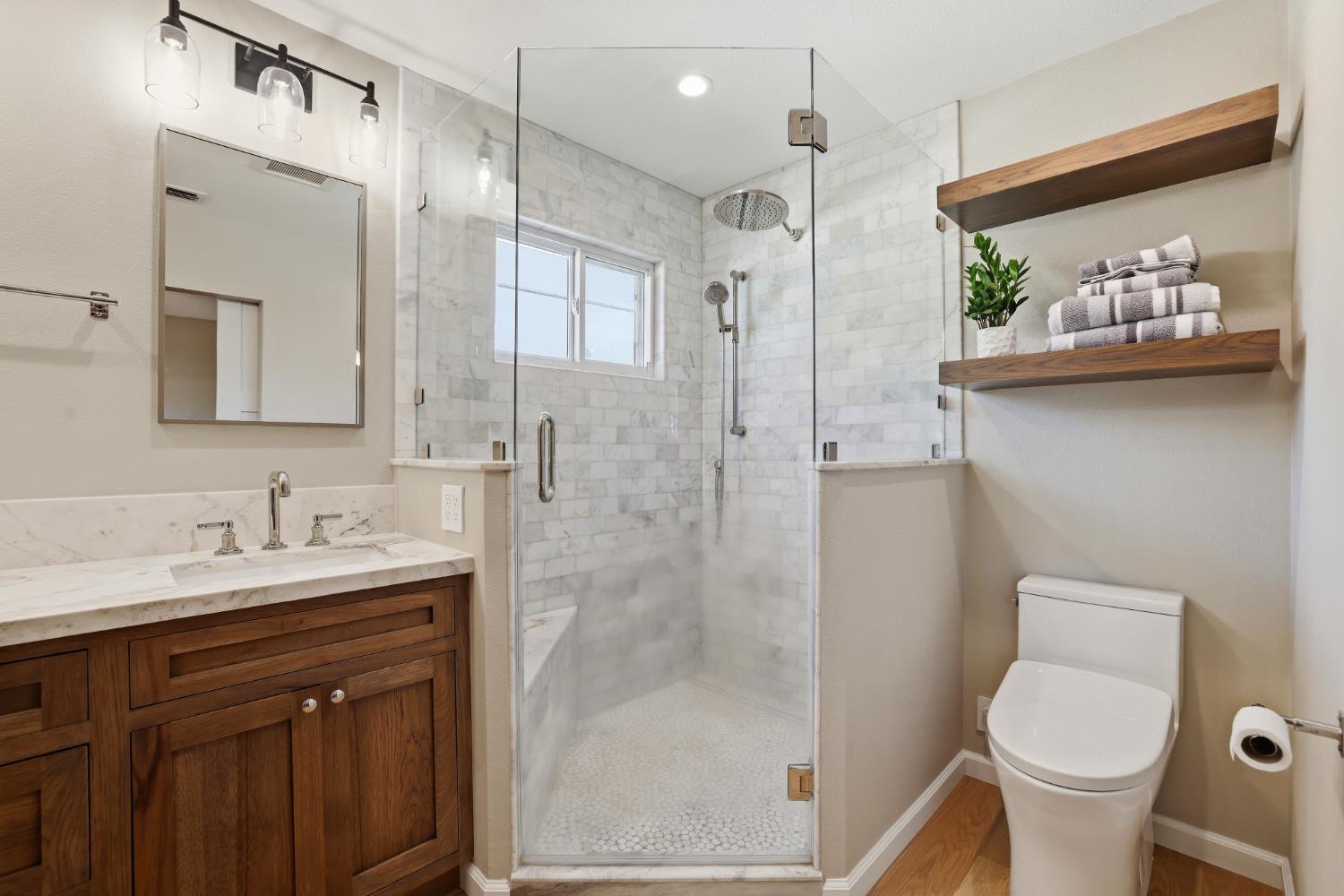 5295 Baumgart Way Carmichael, CA 95608 - Photo 25 of 46 a bathroom with a sink a toilet and shower