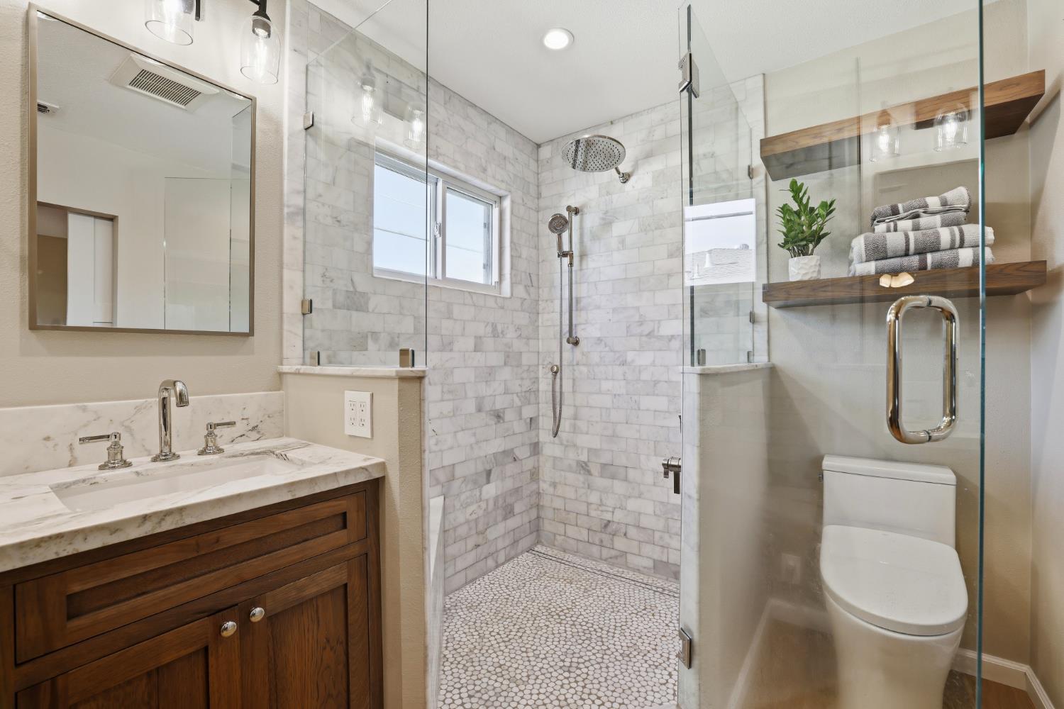 5295 Baumgart Way Carmichael, CA 95608 - Photo 26 of 46 a bathroom with a granite countertop sink toilet and shower