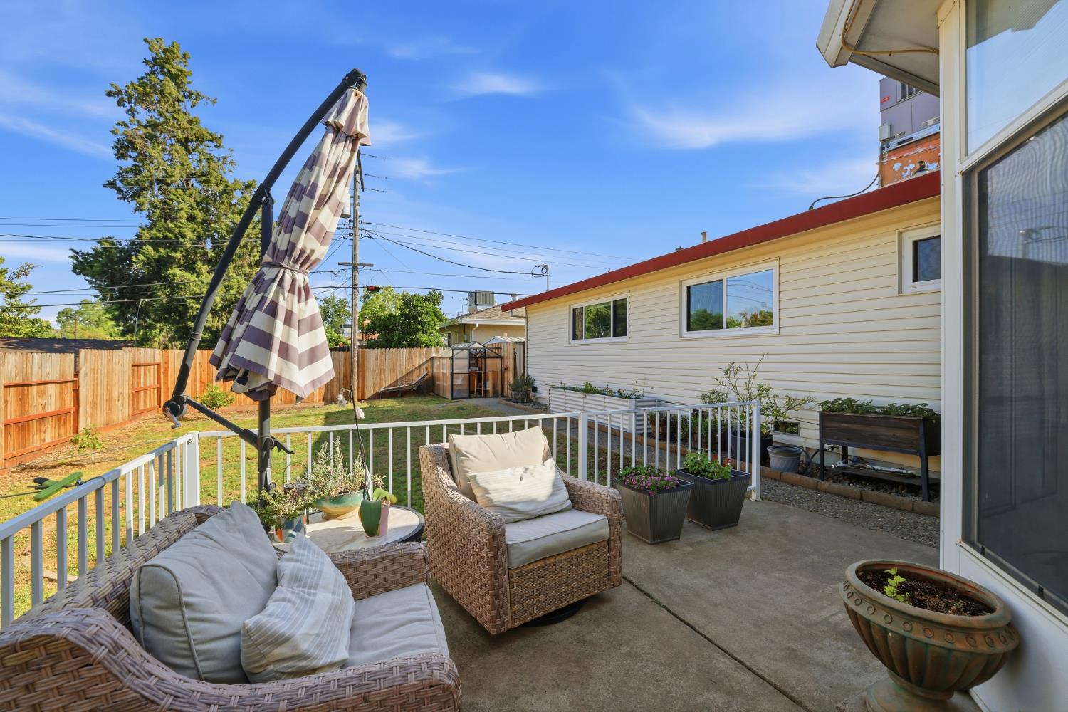 5295 Baumgart Way Carmichael, CA 95608 - Photo 35 of 46 a view of a patio with couches table and chairs and potted plants