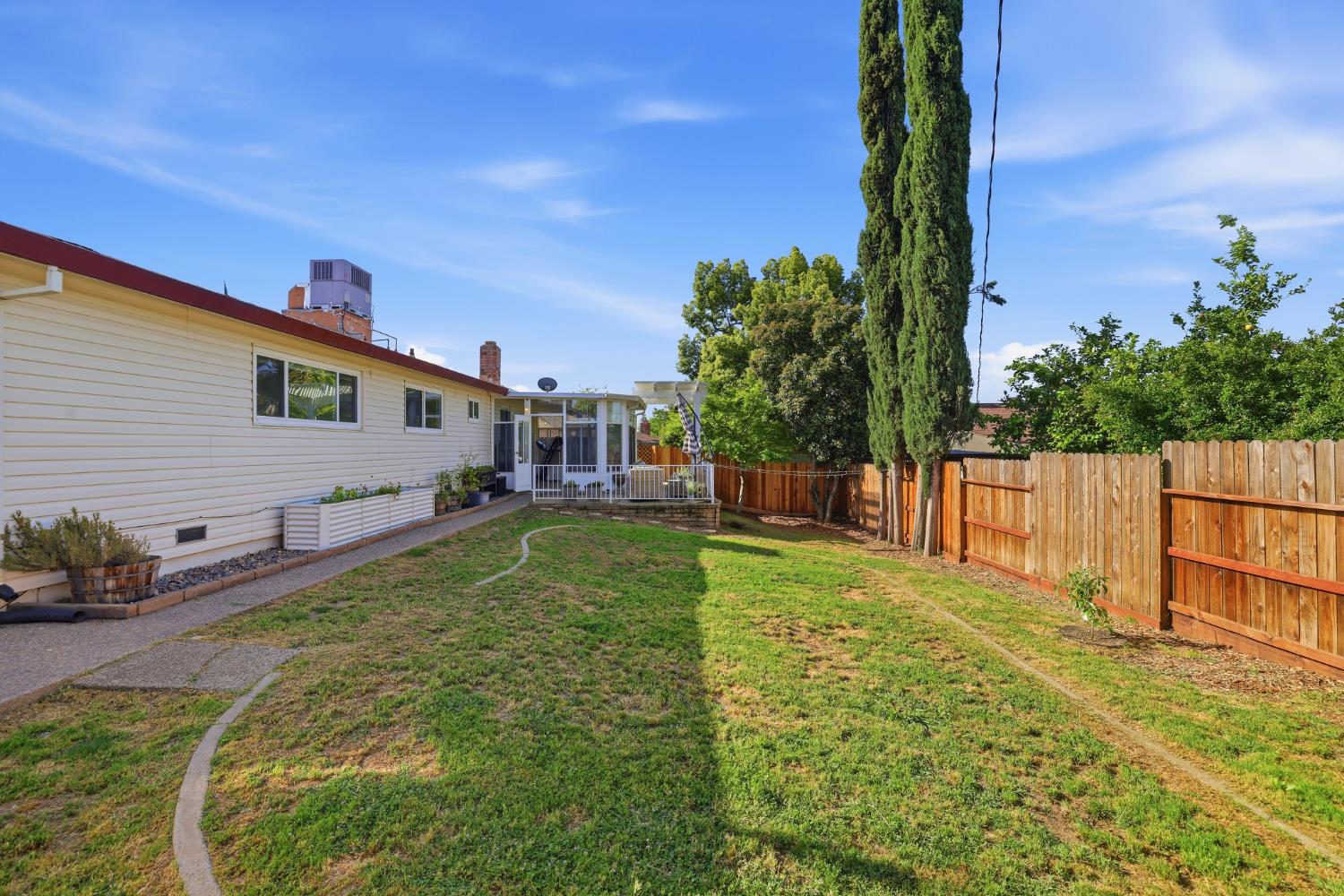 5295 Baumgart Way Carmichael, CA 95608 - Photo 38 of 46 a view of backyard with a garden and plants