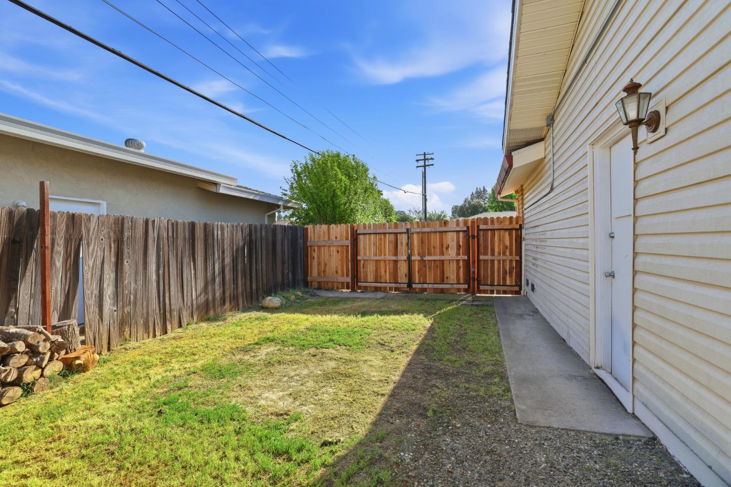 5295 Baumgart Way Carmichael, CA 95608 - Photo 39 of 46 a view of a backyard with wooden fence