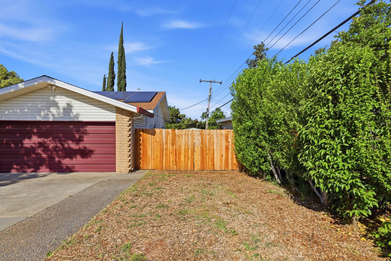 5295 Baumgart Way Carmichael, CA 95608 - Photo 4 of 46 a front view of a house with a yard and garage