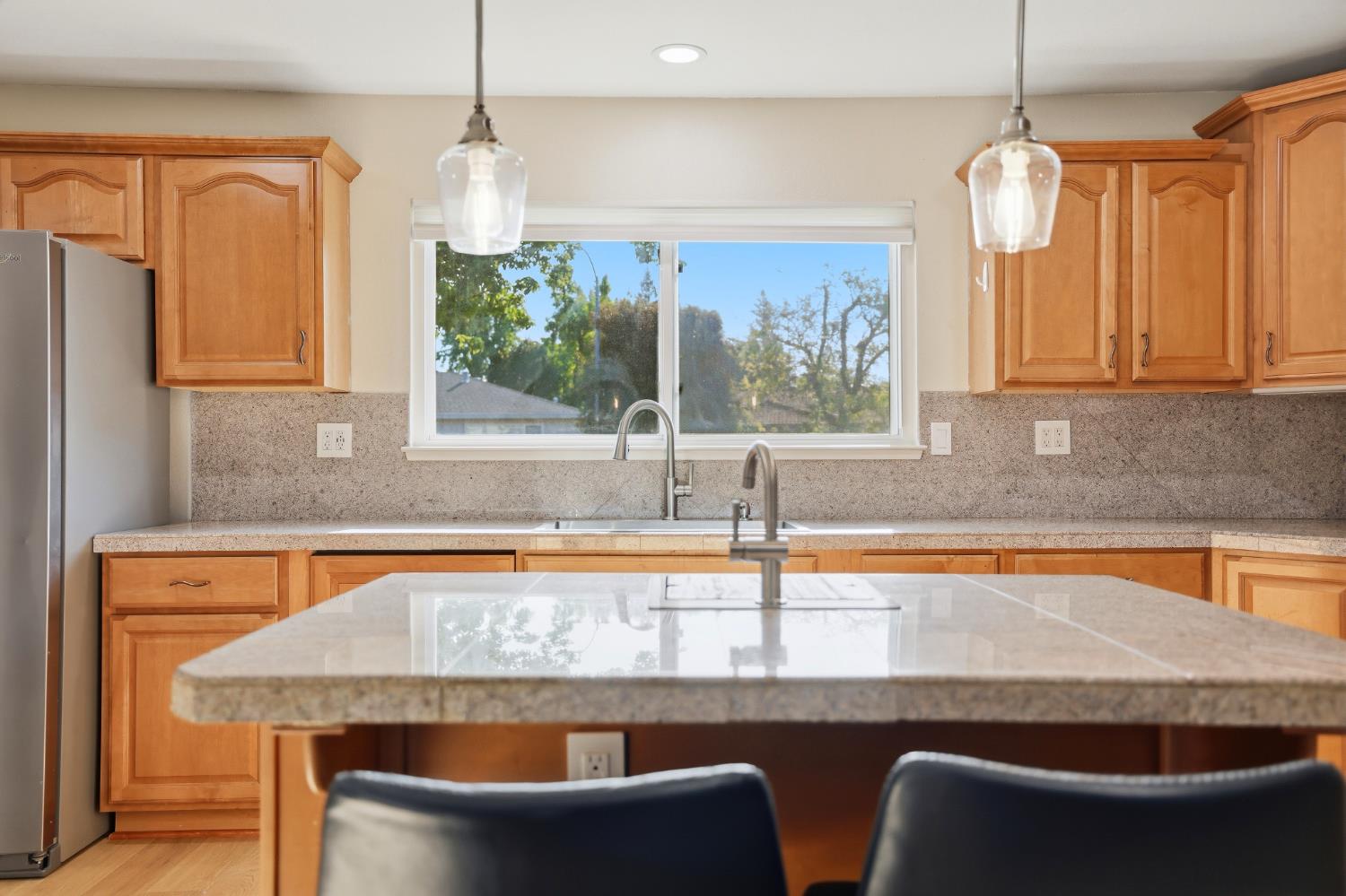 5295 Baumgart Way Carmichael, CA 95608 - Photo 8 of 46 a kitchen with a table chairs and a window
