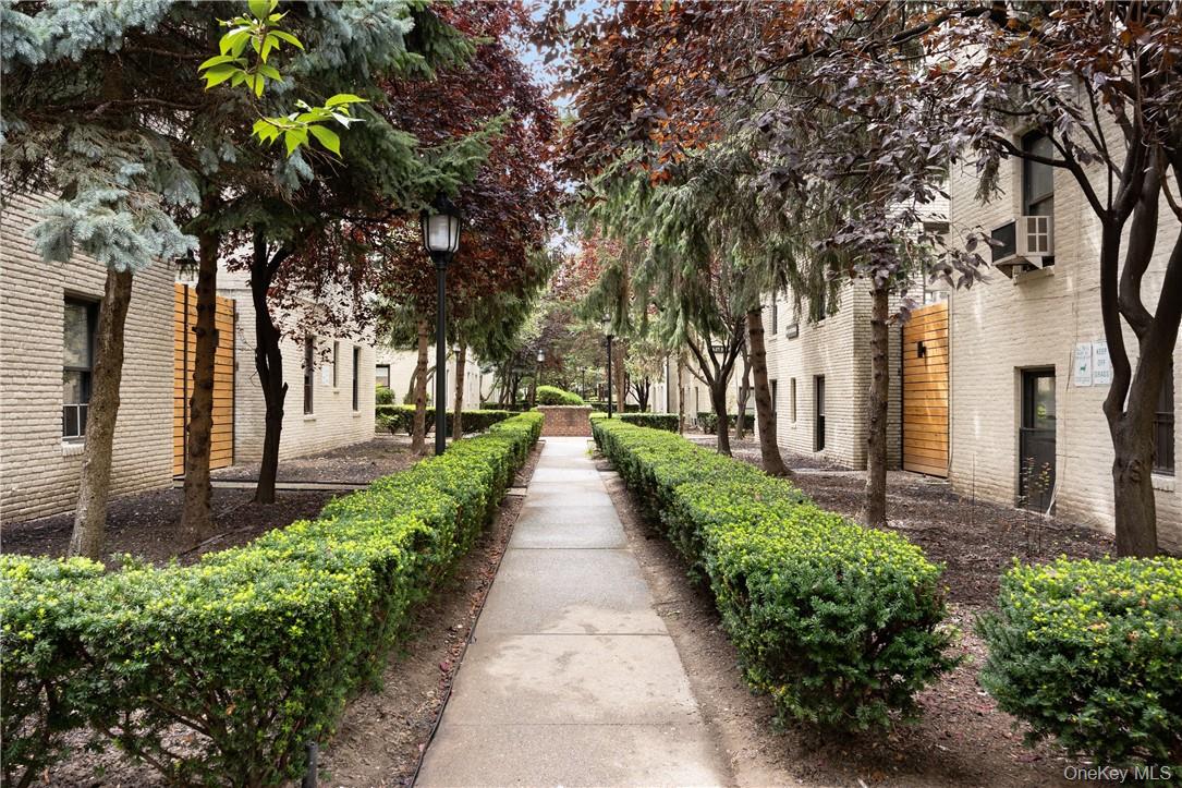 21-15 33rd Street, Unit 4E Queens, NY 11105 - Photo 12 of 13 a view of a pathway with a garden