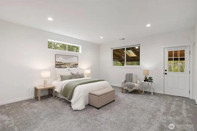 a bedroom with bed and window