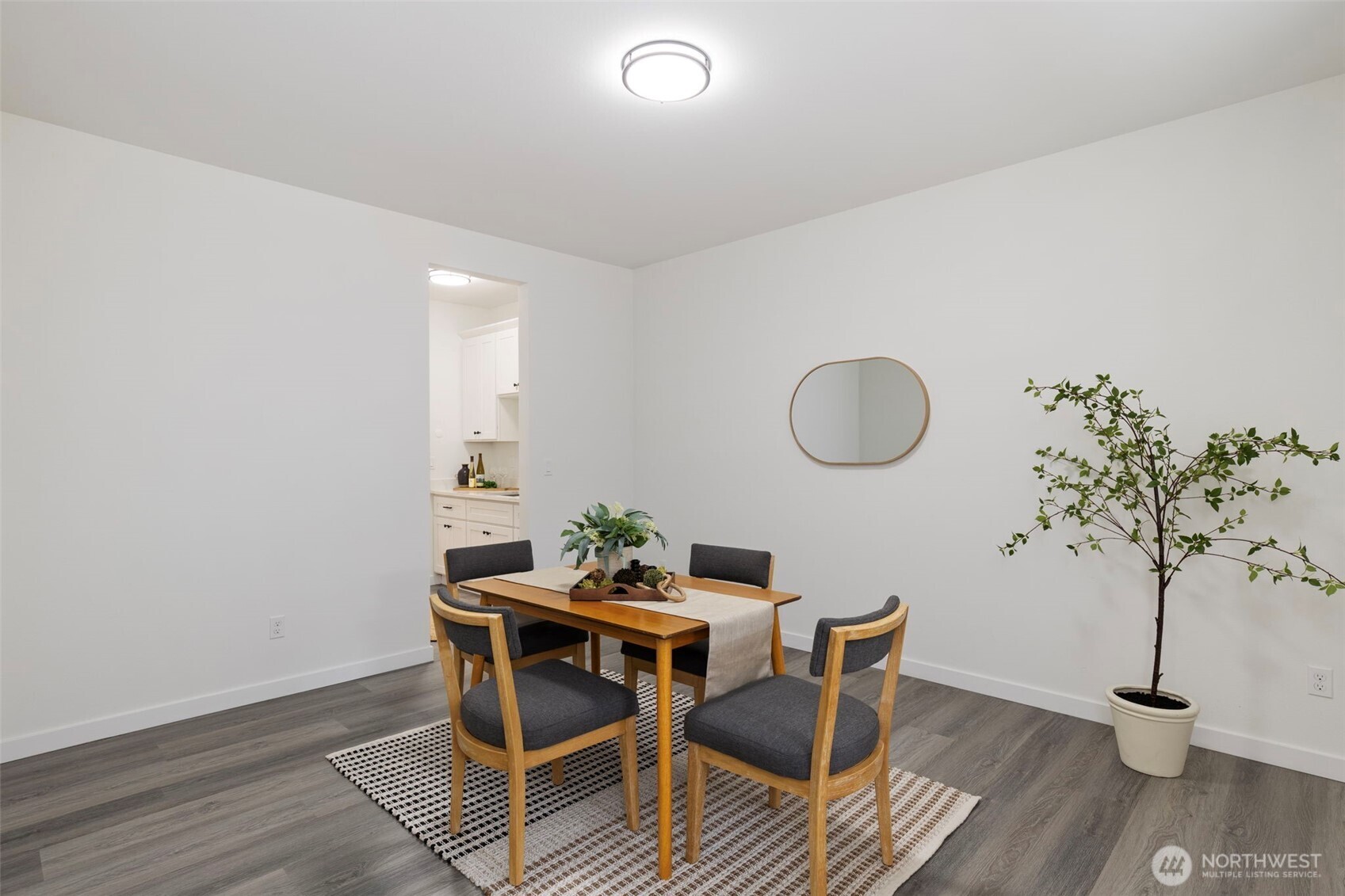 101 Northeast Anvil Lane Belfair, WA 98528 - Photo 14 of 40 a dining room with furniture and wooden floor
