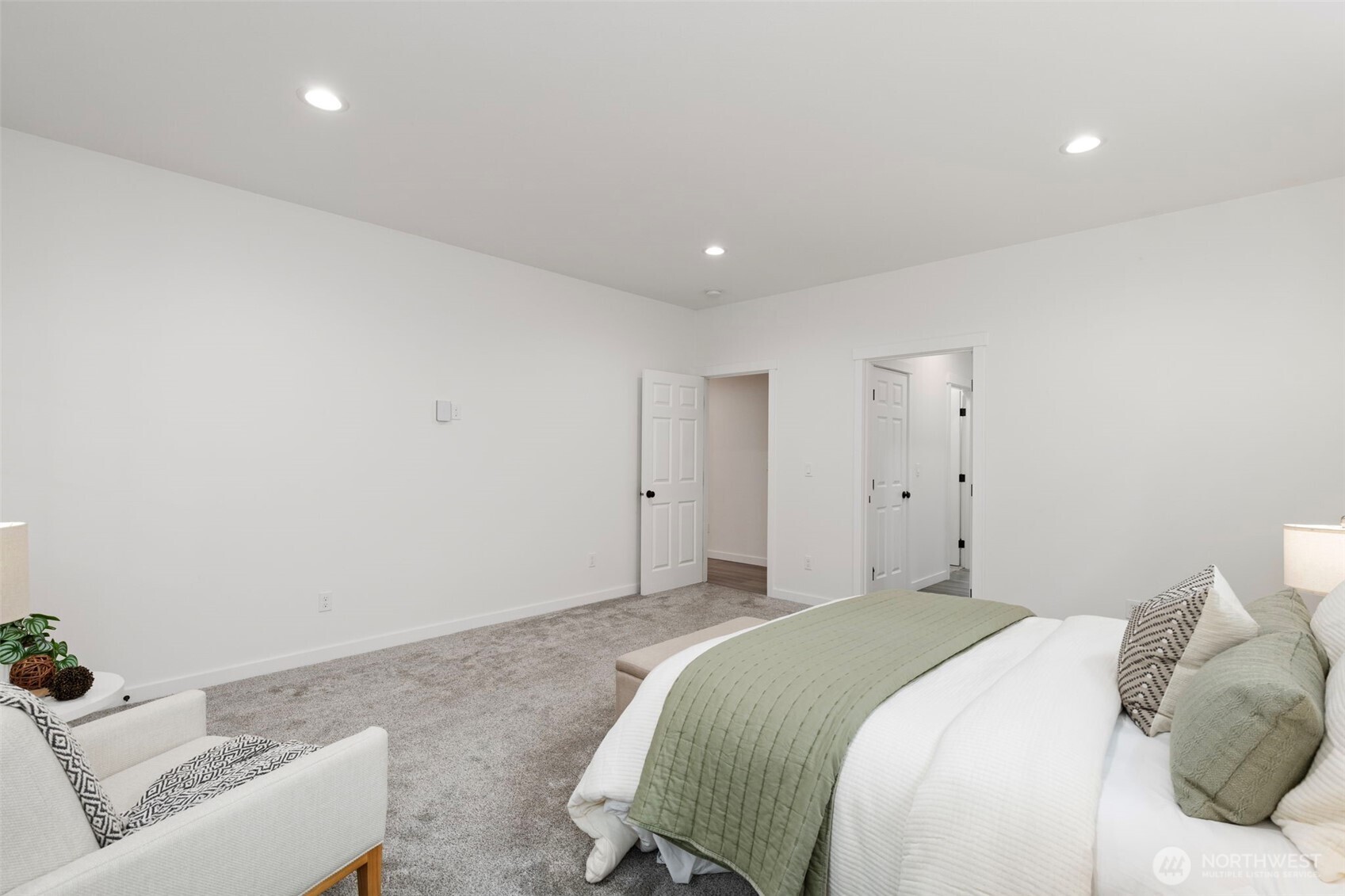 101 Northeast Anvil Lane Belfair, WA 98528 - Photo 16 of 40 a bedroom with a bed and a couch