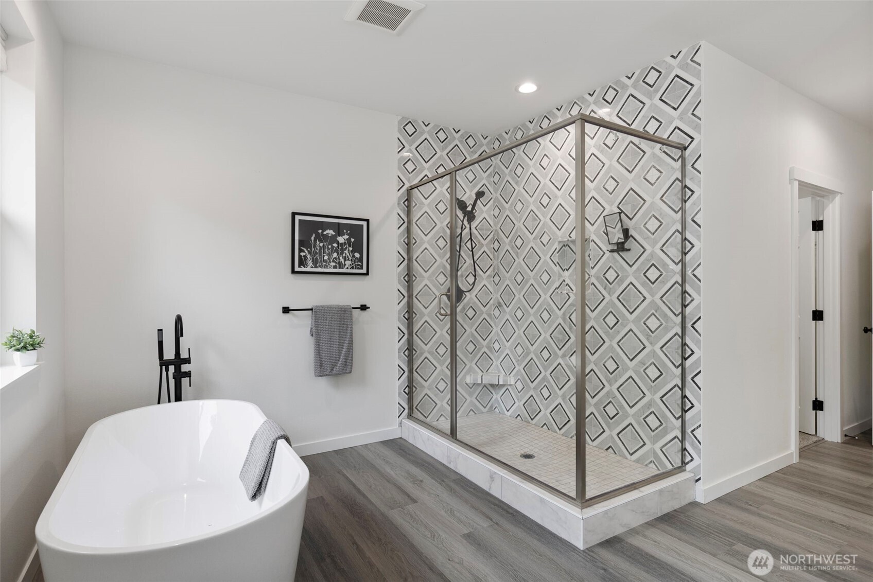 101 Northeast Anvil Lane Belfair, WA 98528 - Photo 18 of 40 a bathroom with a bathtub and shower