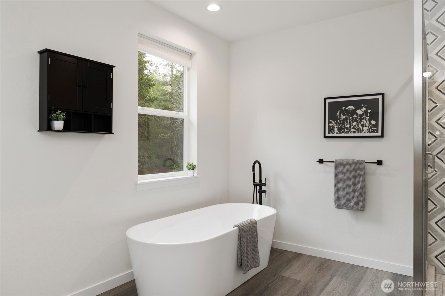 101 Northeast Anvil Lane Belfair, WA 98528 - Photo 19 of 40 a white bath tub sitting in a bathroom
