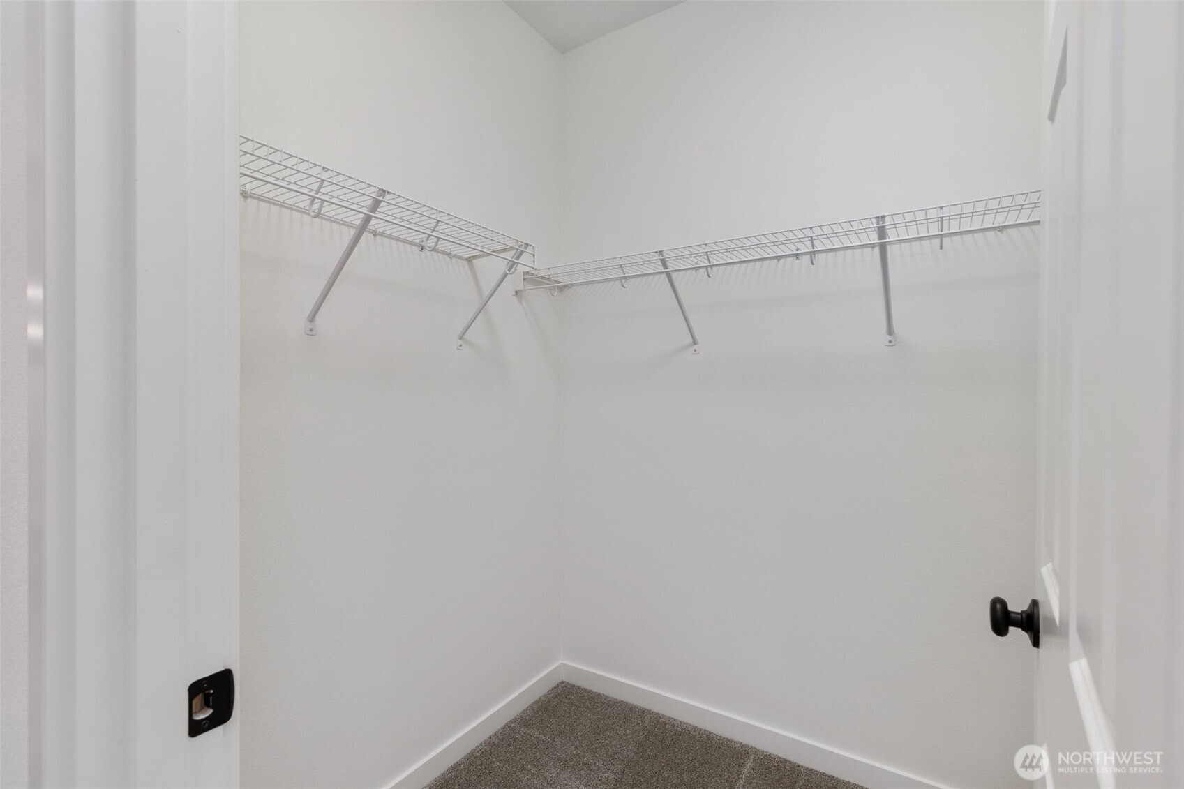 101 Northeast Anvil Lane Belfair, WA 98528 - Photo 21 of 40 a view of a room with racks on the wall