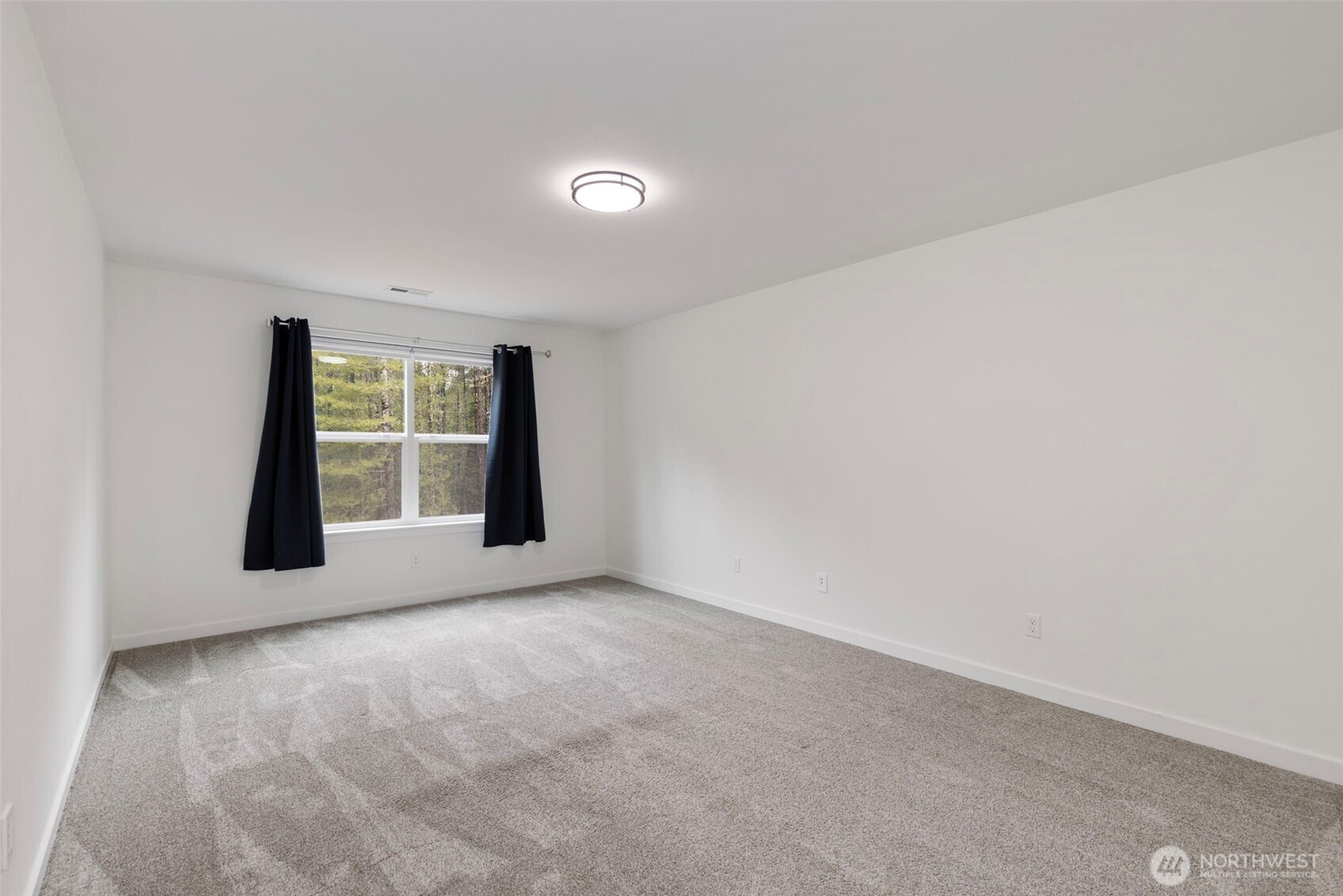 101 Northeast Anvil Lane Belfair, WA 98528 - Photo 29 of 40 an empty room with windows