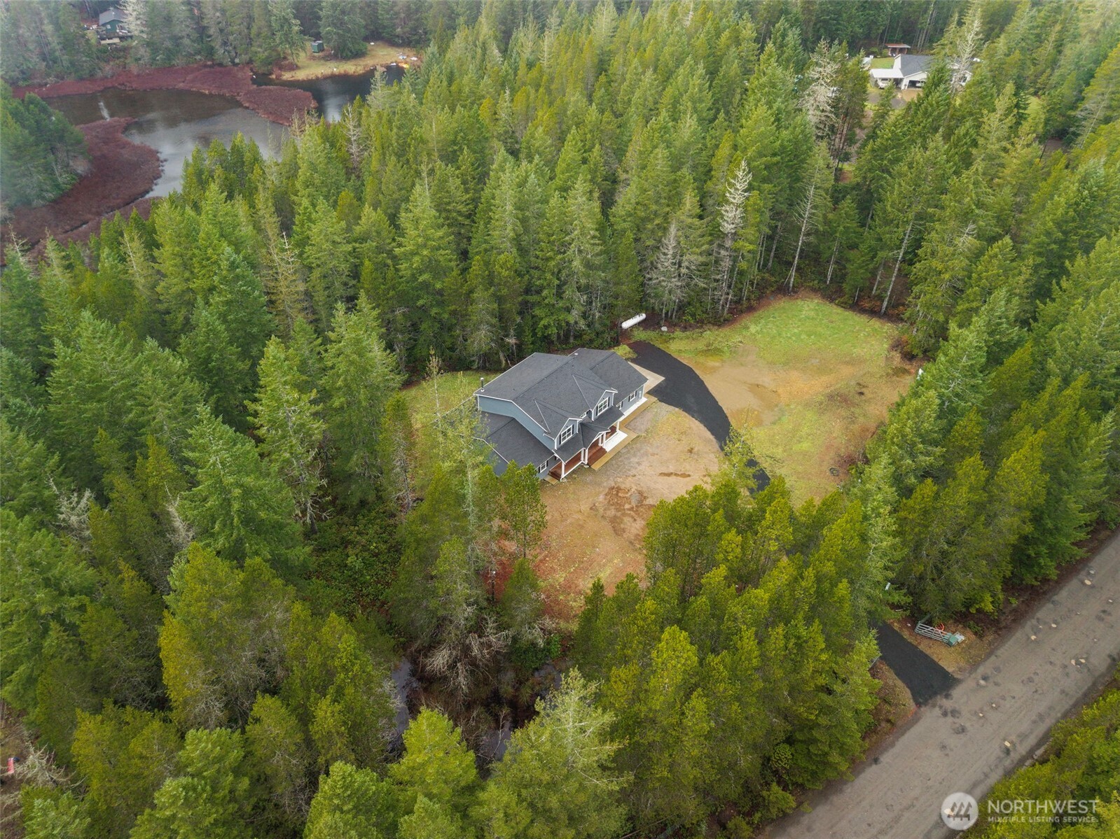 101 Northeast Anvil Lane Belfair, WA 98528 - Photo 39 of 40 a view of a houses with a yard