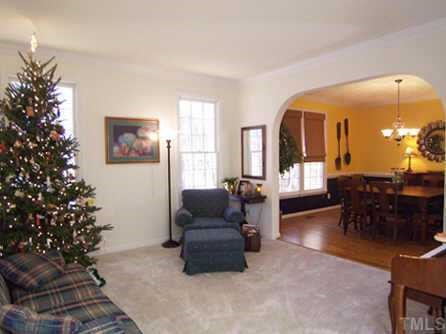 2905 Funster Lane Raleigh, NC 27615 - Photo 3 of 12 a living room with furniture and a potted plant
