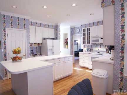 2905 Funster Lane Raleigh, NC 27615 - Photo 6 of 12 a large white kitchen with a sink dishwasher stove and refrigerator