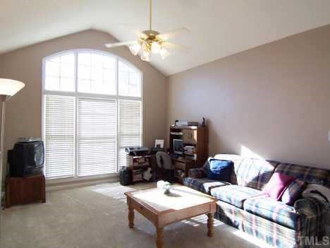2905 Funster Lane Raleigh, NC 27615 - Photo 8 of 12 a living room with furniture and a large window