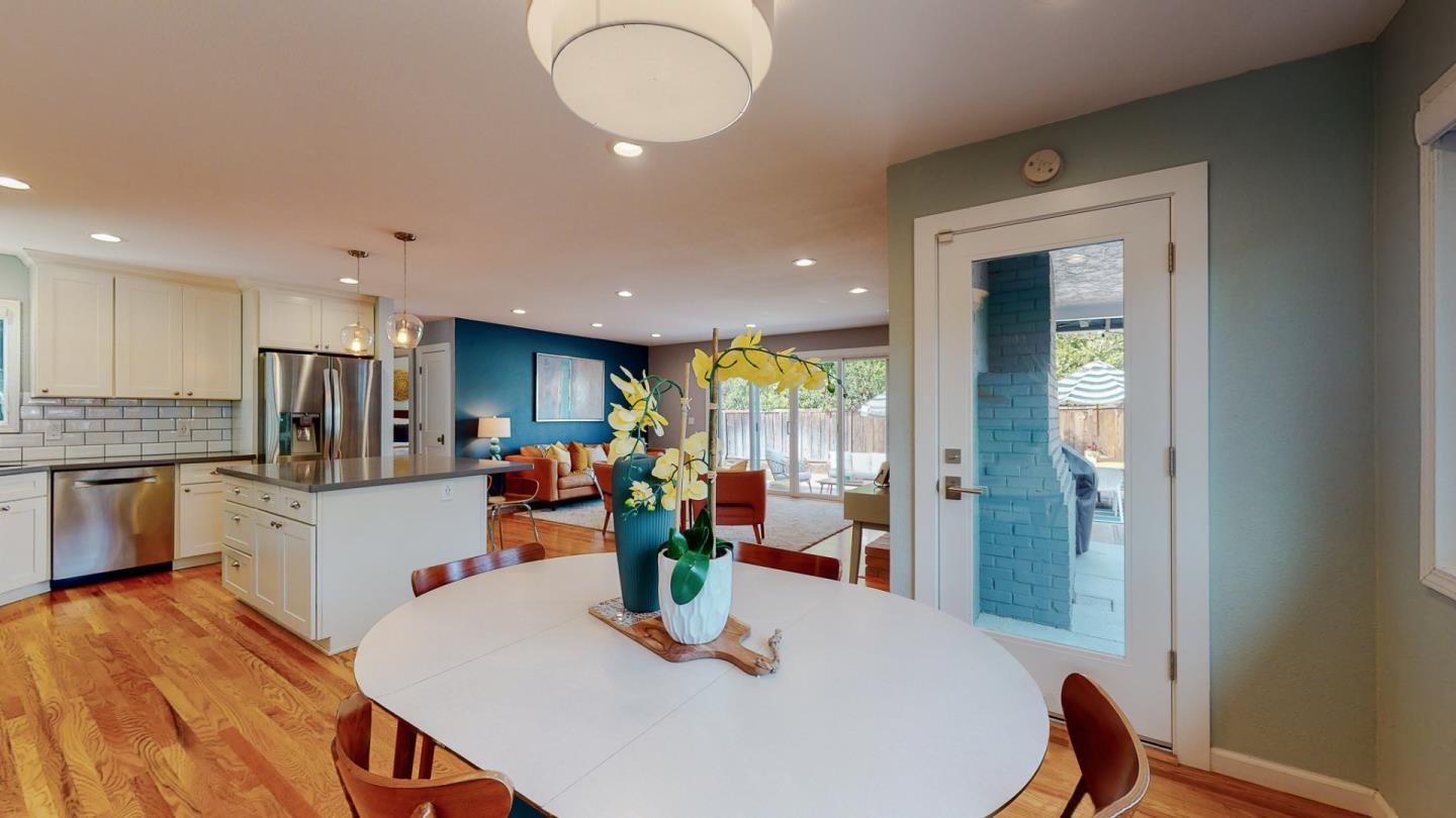 5378 Carter Avenue San Jose, CA 95118 - Photo 11 of 38 a kitchen with stainless steel appliances granite countertop sink refrigerator dining table and chairs