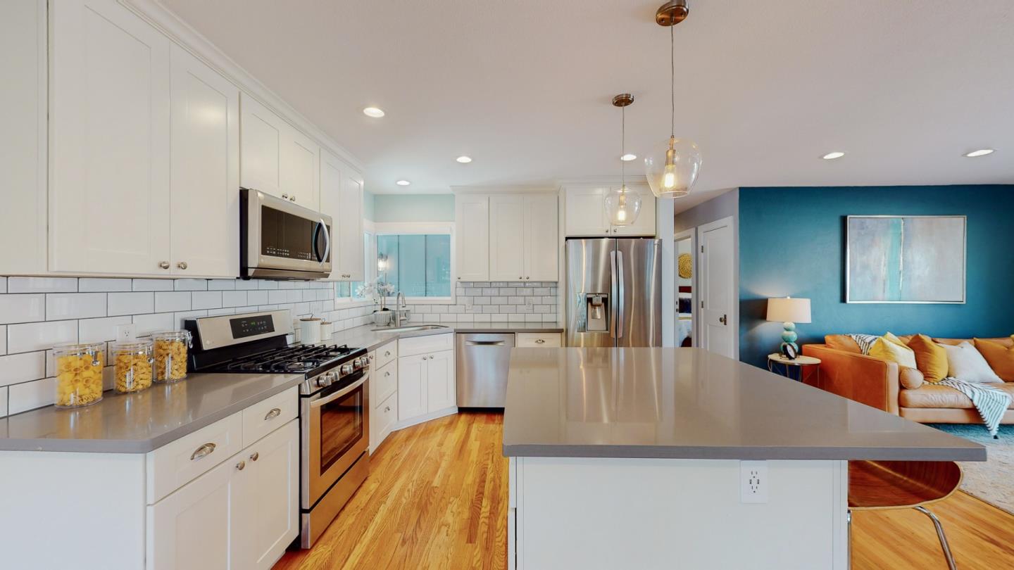5378 Carter Avenue San Jose, CA 95118 - Photo 12 of 38 a kitchen with stainless steel appliances granite countertop a sink refrigerator and cabinets