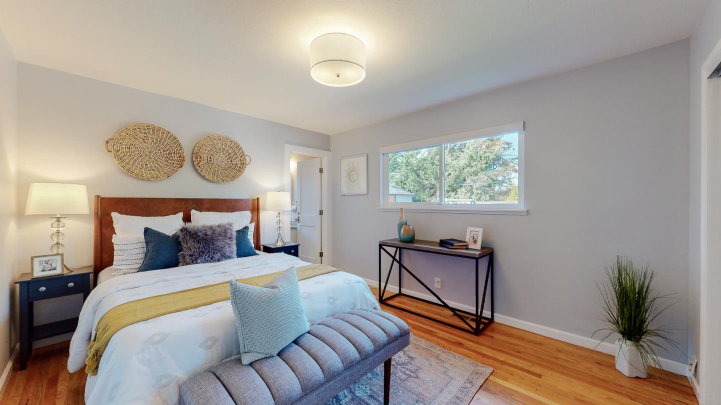 5378 Carter Avenue San Jose, CA 95118 - Photo 15 of 38 a bedroom with a bed and window