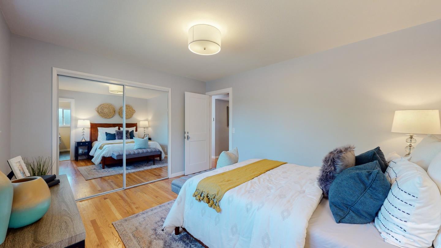 5378 Carter Avenue San Jose, CA 95118 - Photo 17 of 38 a bedroom with a bed and a lamp