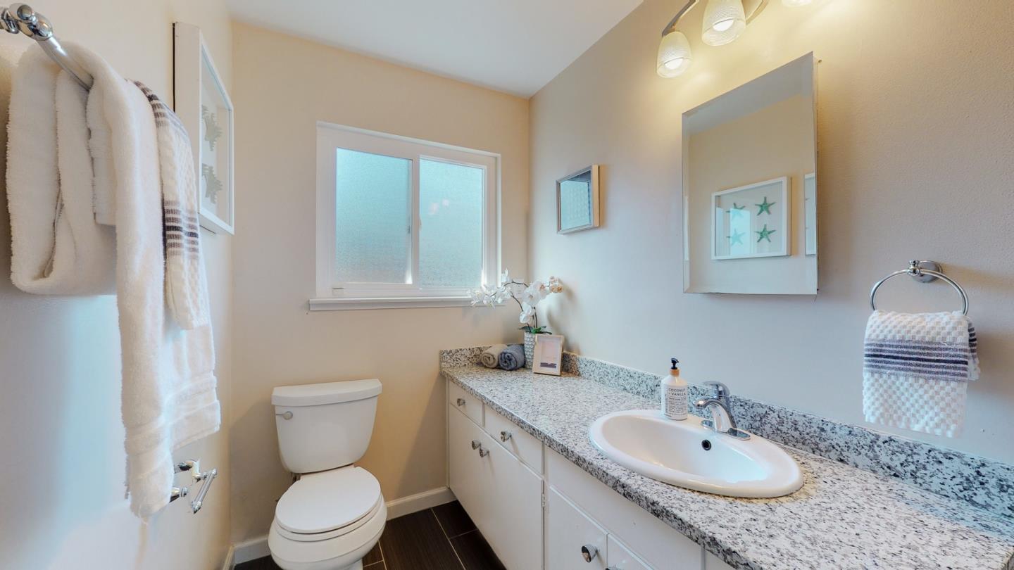 5378 Carter Avenue San Jose, CA 95118 - Photo 19 of 38 a bathroom with a granite countertop sink toilet and shower