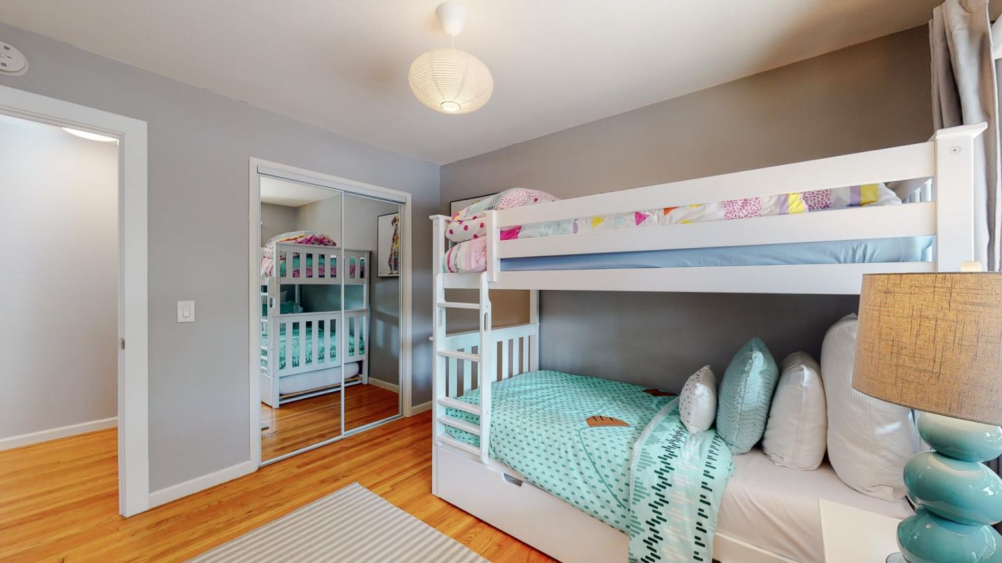 5378 Carter Avenue San Jose, CA 95118 - Photo 21 of 38 a bedroom with furniture and a book shelf