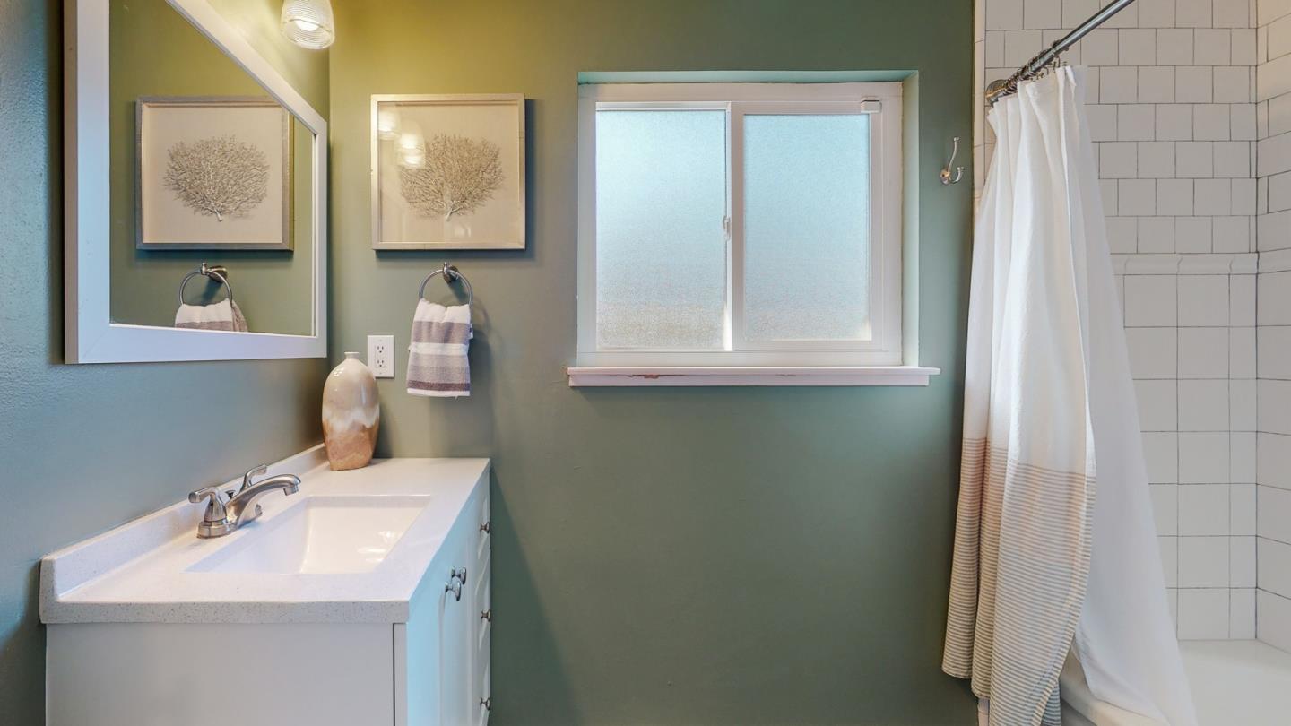 5378 Carter Avenue San Jose, CA 95118 - Photo 24 of 38 a bathroom with a sink toilet and mirror
