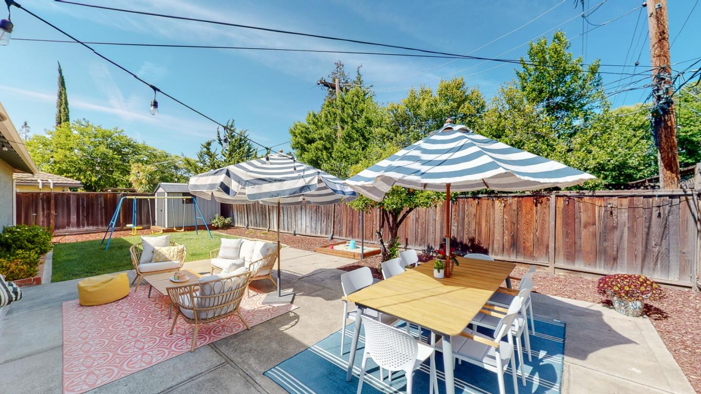 5378 Carter Avenue San Jose, CA 95118 - Photo 29 of 38 a patio with a table and chairs and potted plants