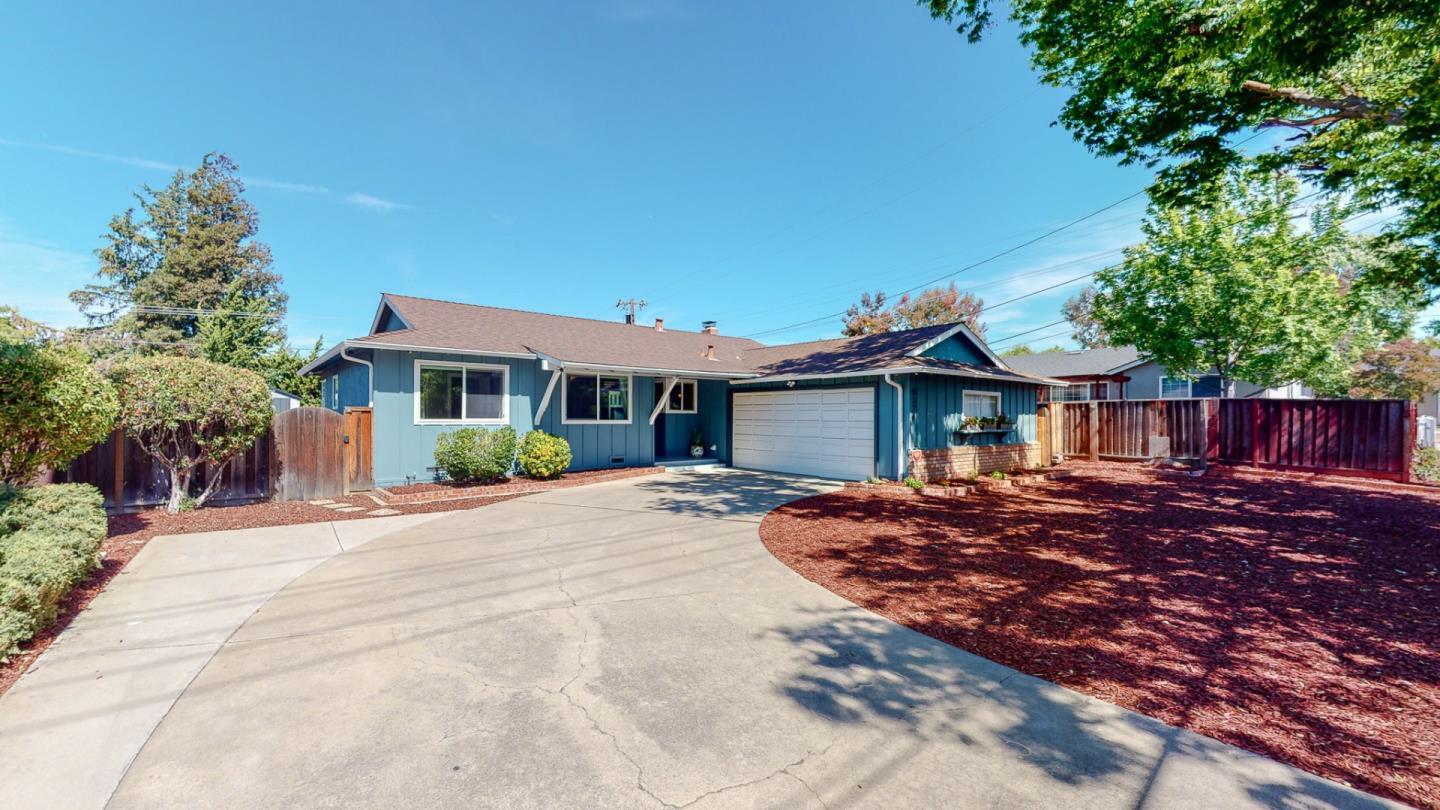 5378 Carter Avenue San Jose, CA 95118 - Photo 3 of 38 a front view of a house with a yard